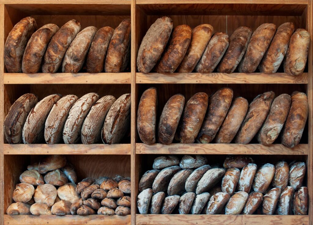Variety of artisan breads on a wooden board