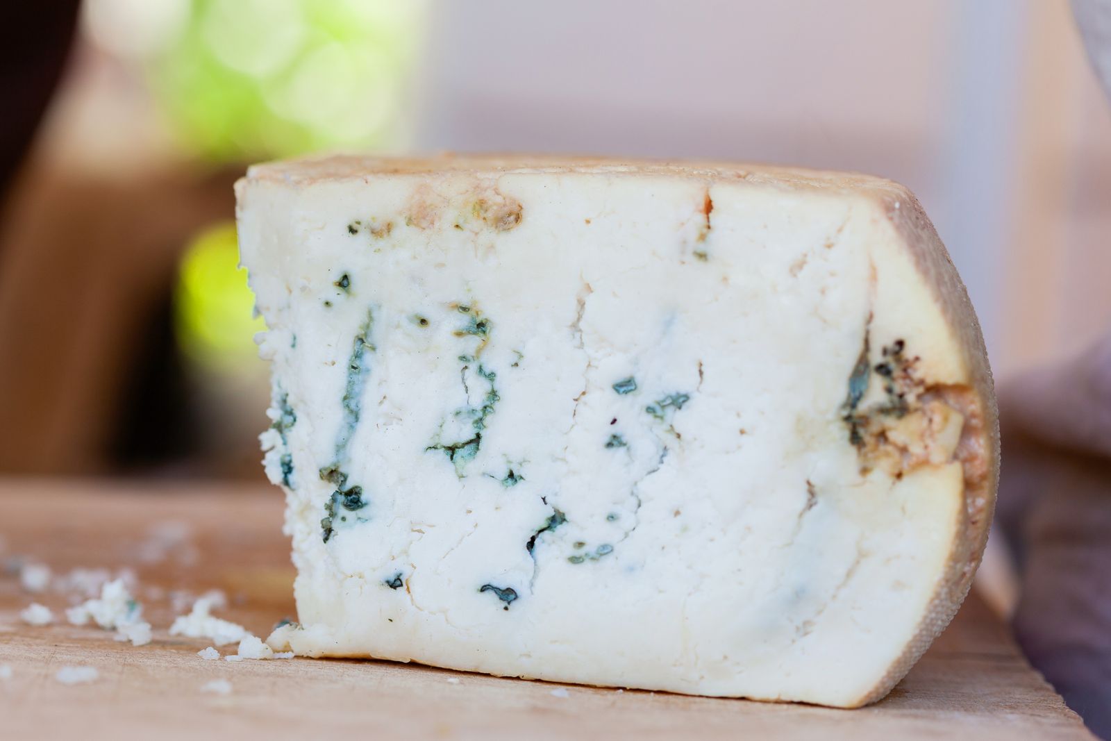 Close up of an artisan blue cheese wedge