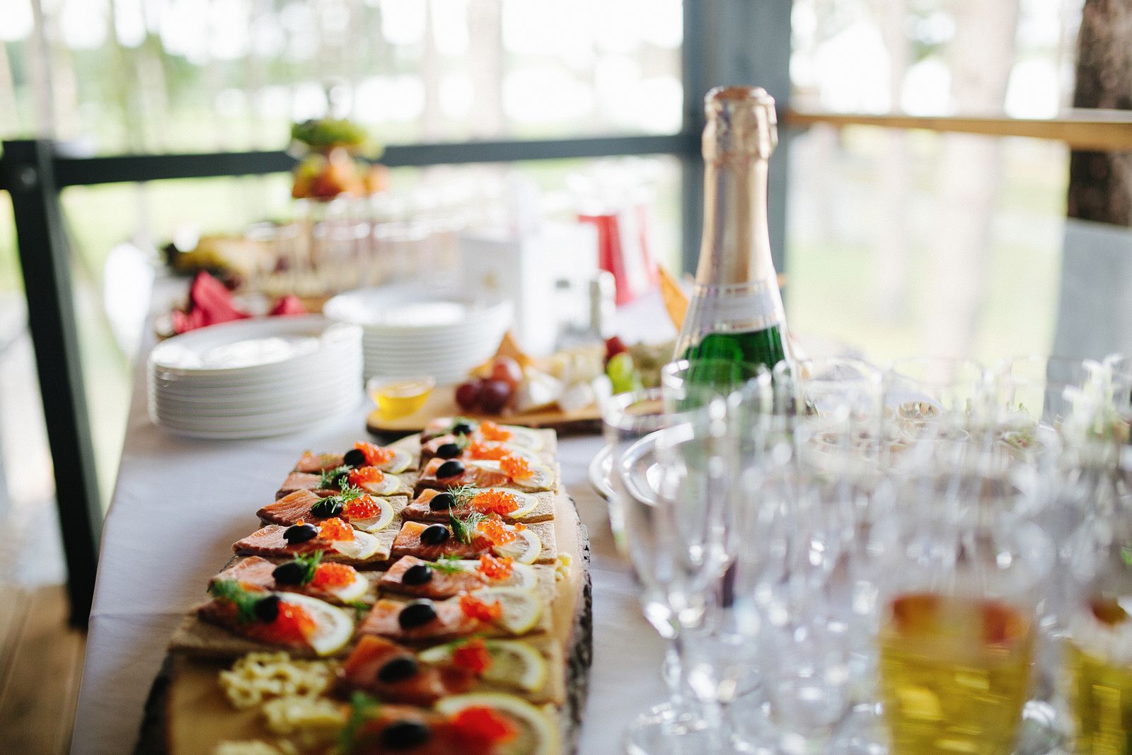 Champagne bottle with elegant hors d oeuvres