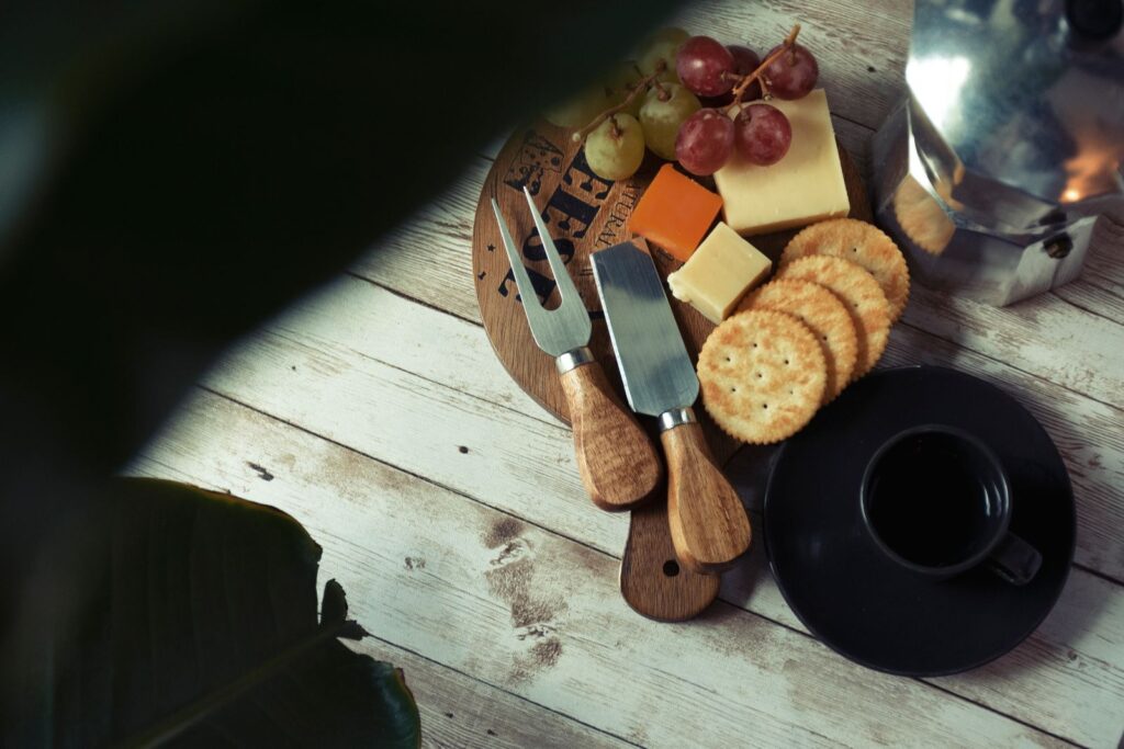 Rustic cheese and cracker setup on a wooden board