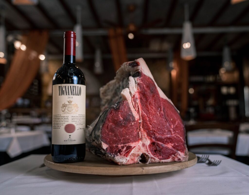Ribeye steak with a bottle of red wine for a Cabernet Sauvignon pairing