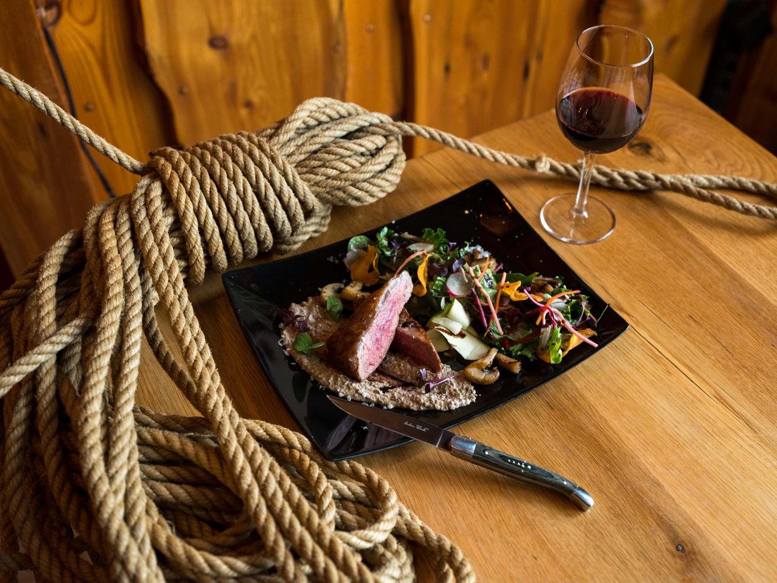 Sliced beef steak on a ceramic plate